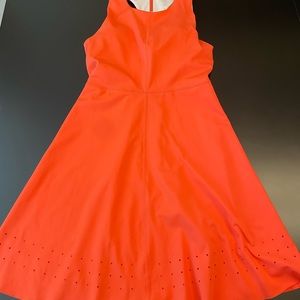 Zella, orange workout dress. Perforation on bottom of dress. Excellent condition